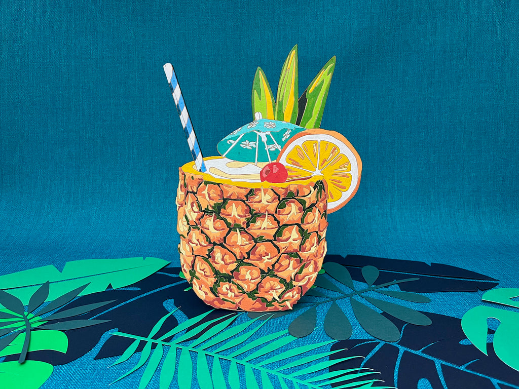 Tiki Lovers UNITE! The new Tiki Time Paint by Numbers collection features four beautiful drinks. The Painkiller paint by number is hands down the most complex design of the bunch. The base of the design is an intricate pattern of colors creating the beautiful hexagons of a pineapple. The center hints to the creamy, sweet drink. Garnishing the rim is a party of color! Greens of pineapple leaves, the vibrant bright orange, and a bright red cherry speared with a classic paper umbrella. 