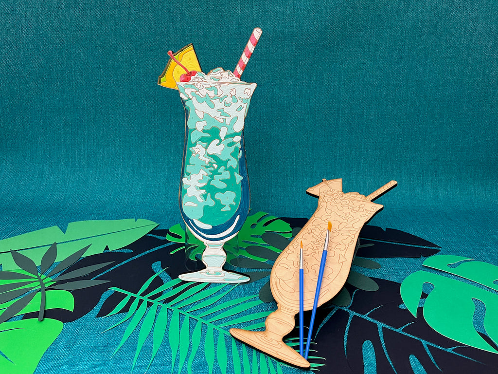 The Blue Hawaiian Tiki Drink Paint by Number Kit features beautiful shades of blue and teal. A great craft kit for adults that are young at heart!