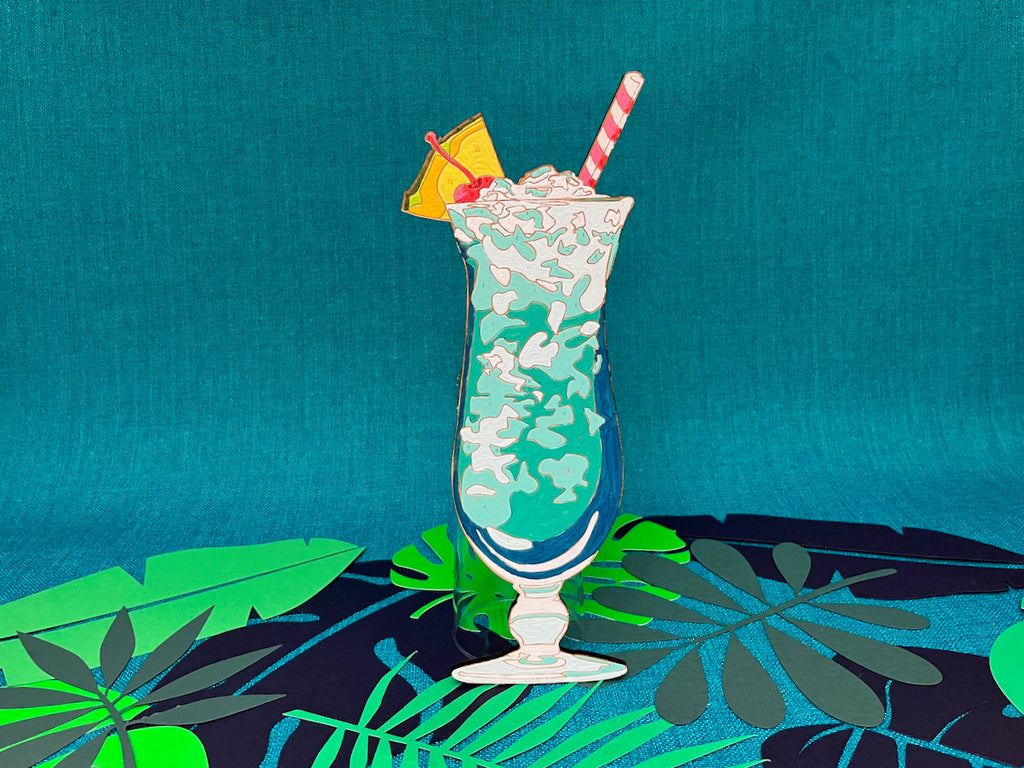Tiki Lovers UNITE! The new Tiki Time series features four beautiful drinks. The Blue Hawaiian paint by number kit towers over the other three in it's tall hurricane glass. Complete with Pineapple Garnish, Stripped Paper Straw, and a cherry on top.